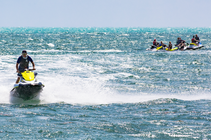 a man riding a jet ski in the water