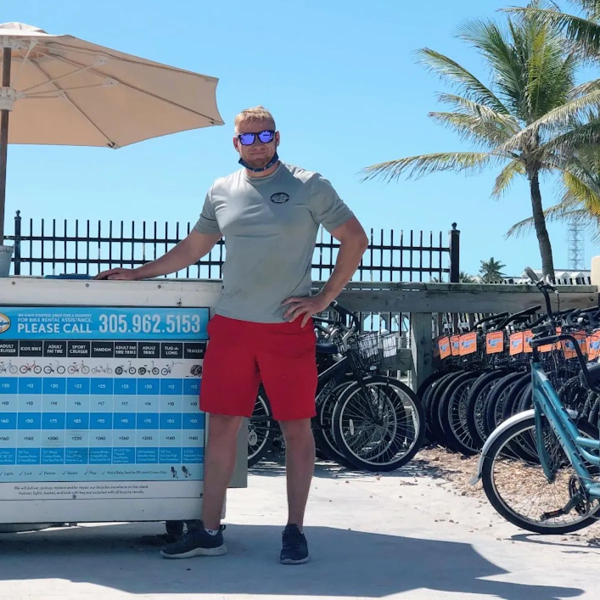 a person standing in front of a bicycle