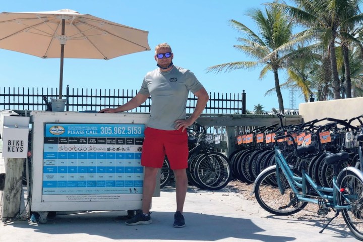 a person standing in front of a bicycle