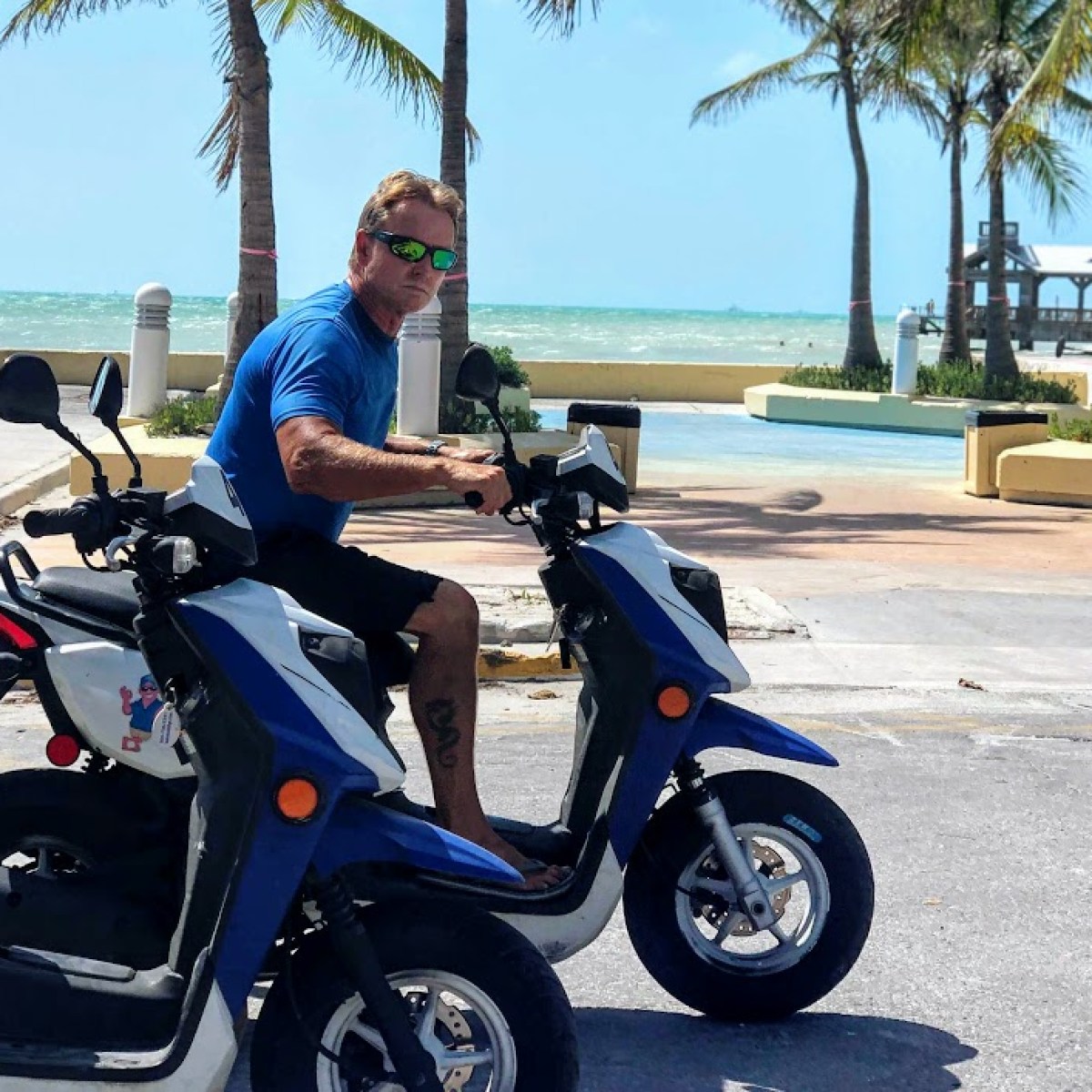 a person riding on the back of a scooter